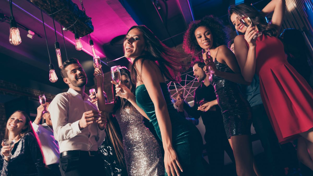 Group of young people socialising at a night event